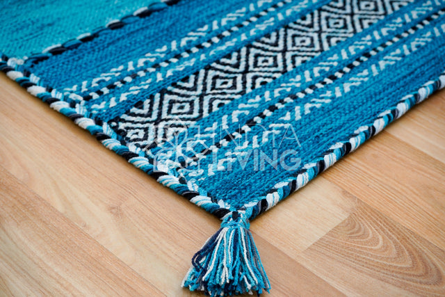 Close-up of cotton chenille weave on teal blue kilim rug