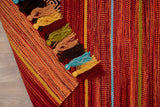 Red striped kilim rug styled in living room