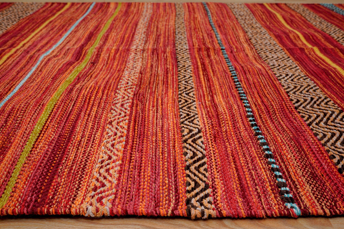 Red striped kilim rug pattern close-up