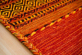 Orange rug corner detail showing pattern