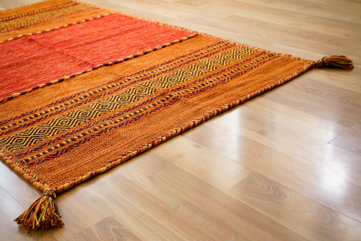 Orange kilim rug in natural light