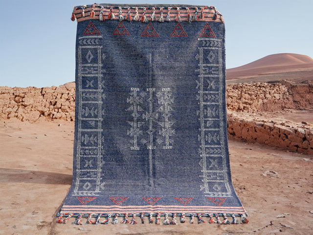 Blue Moroccan kilim wool area rug, flat lay view