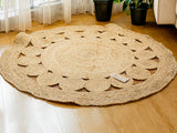 Round jute rug styled in an entryway