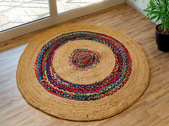 Jute chindi braided round rag rug styled in living room