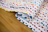 Rainbow rag rug styled in a living room setting