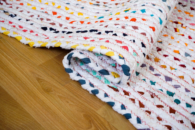 Rainbow rag rug styled in a living room setting