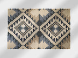 Beige blue kilim rug styled in a Scandinavian living room