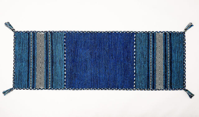 Blue kilim runner styled in a hallway