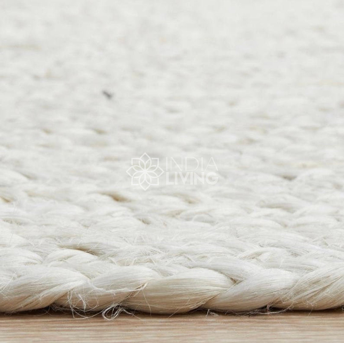 White jute rug styled in living room