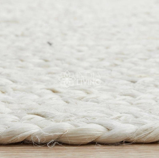 White jute rug styled in living room