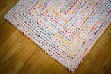Detail shot of cotton strip texture on rainbow rug