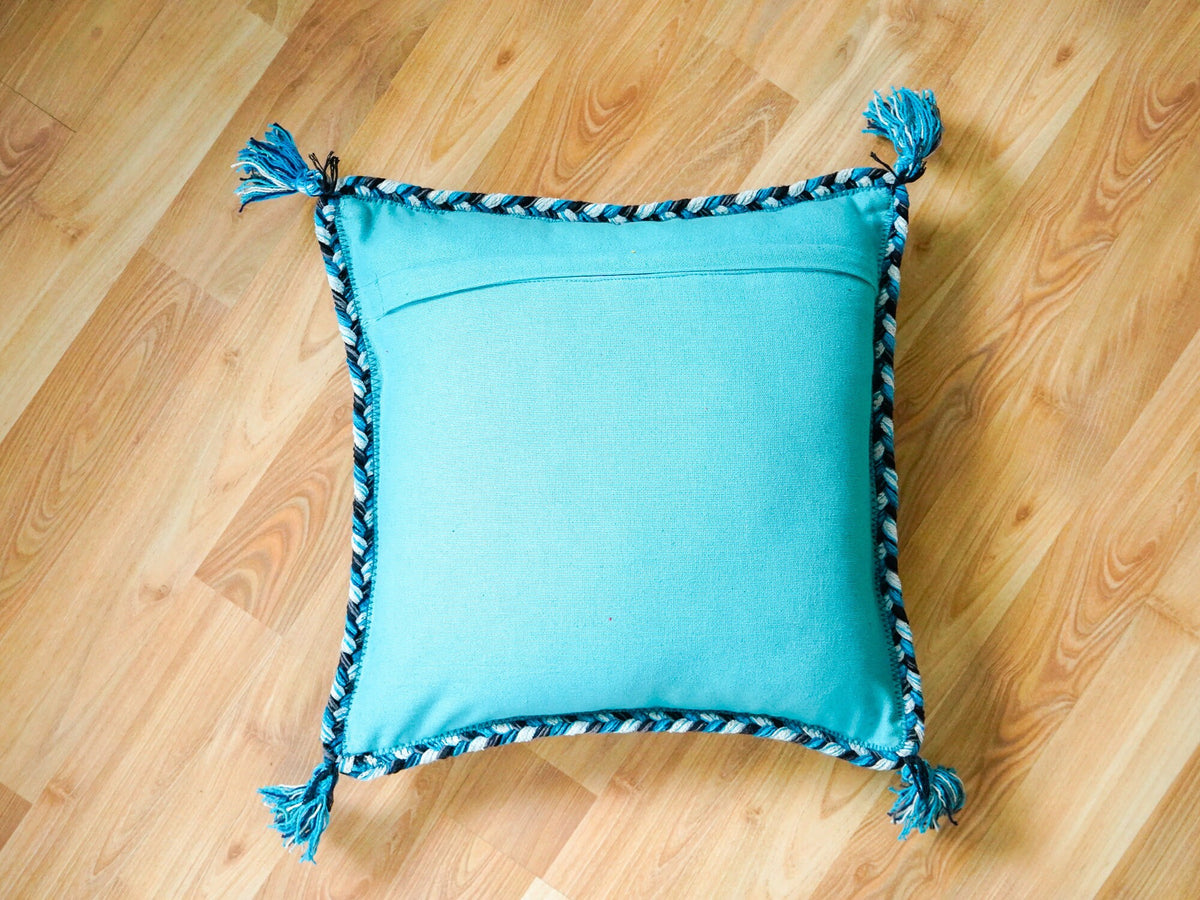 Light blue Moroccan cushion set corner and tassel detail