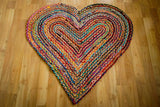 Heart shaped multicolour chindi rag rug flat view showing braided pattern