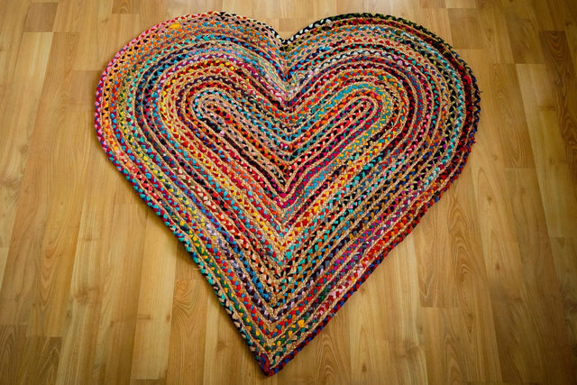 Heart shaped multicolour chindi rag rug flat view showing braided pattern