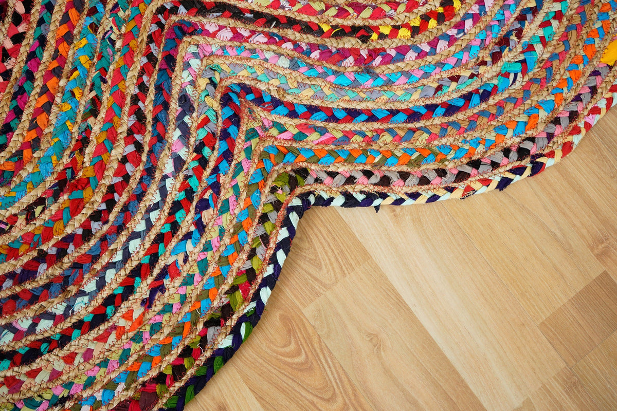 Multicolour rag rug placed beside a reading chair