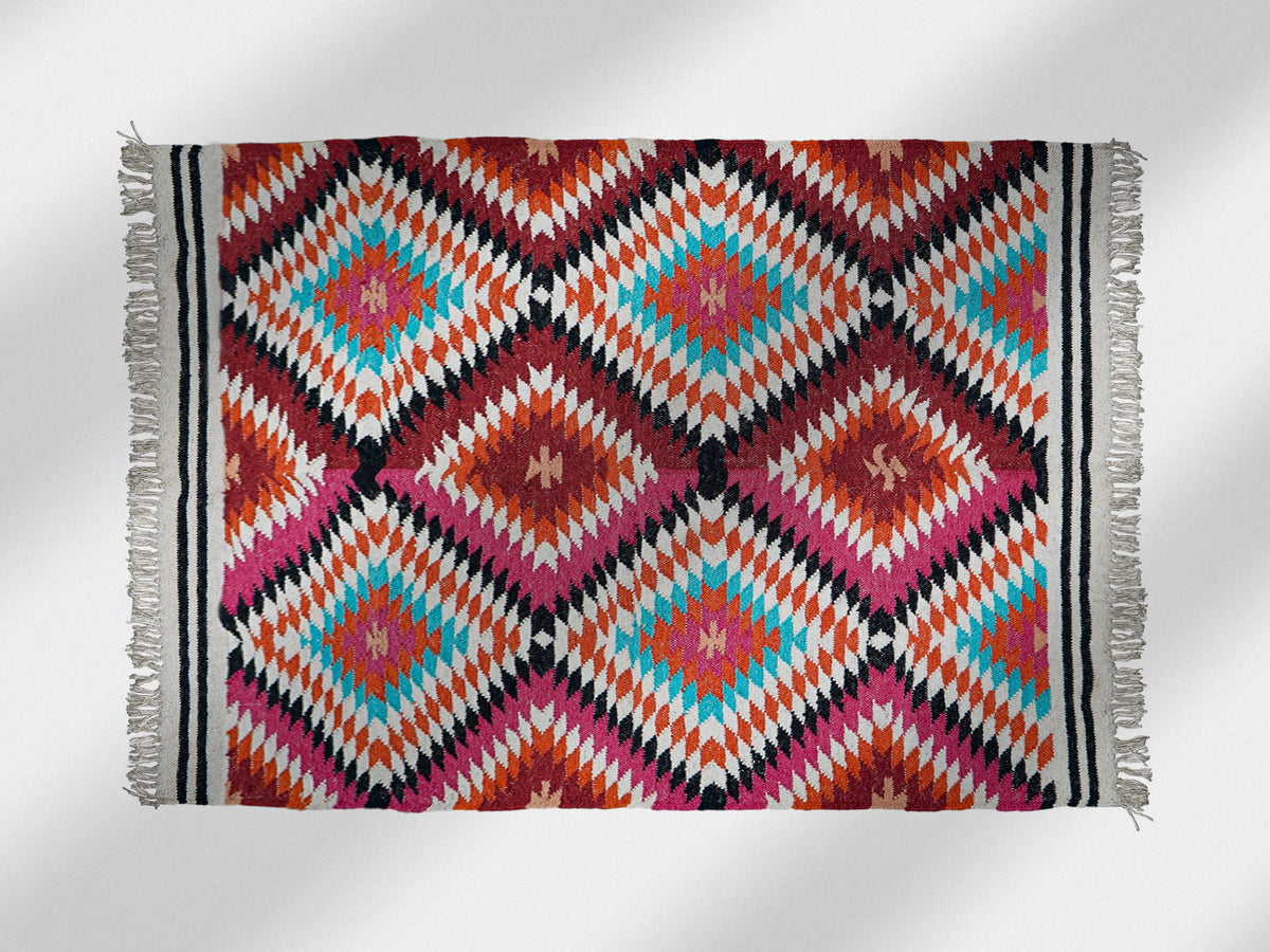 Rainbow kilim rug flat view showing abstract diamond pattern