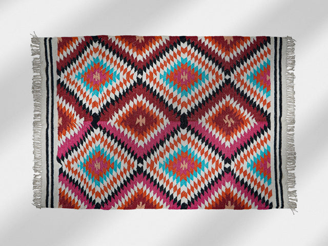 Rainbow kilim rug flat view showing abstract diamond pattern