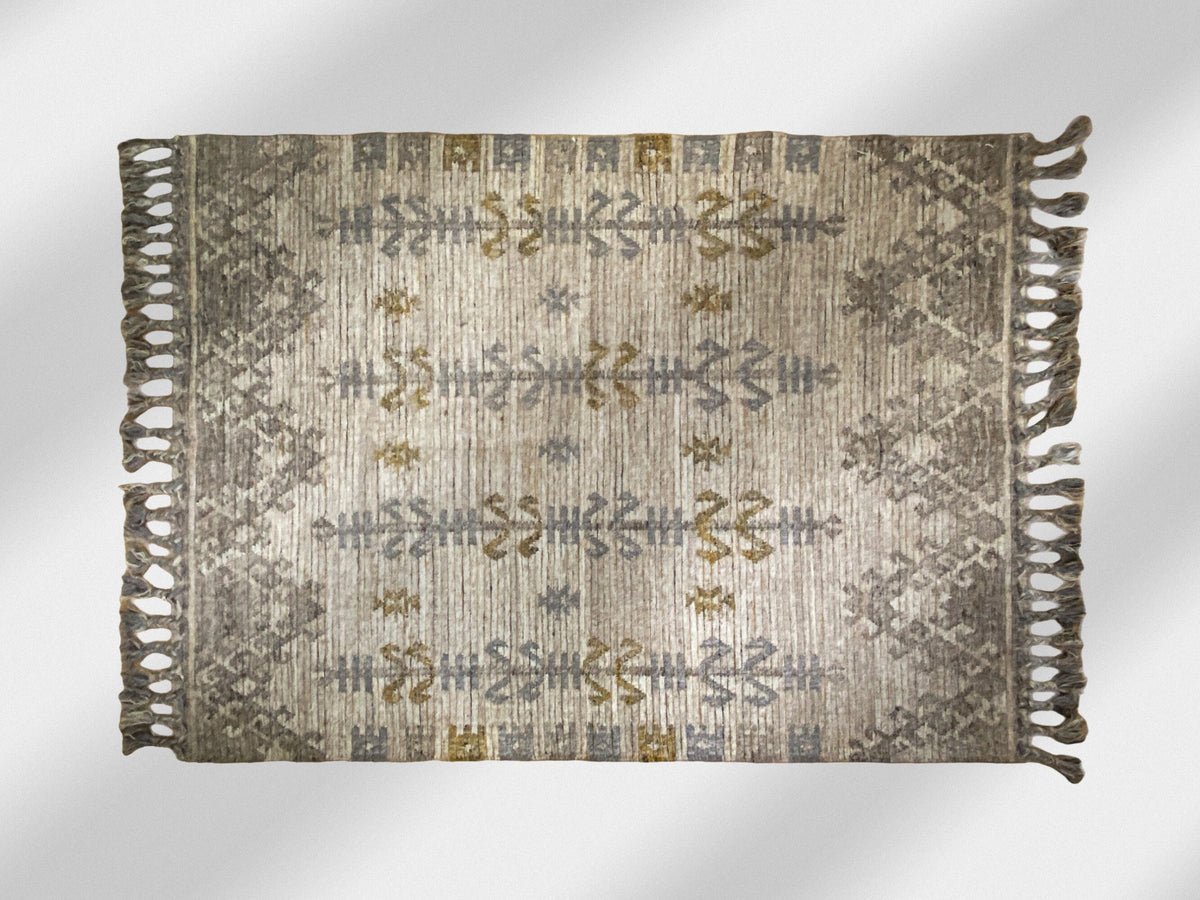 Beige grey kilim rug in bedroom setting