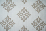 White wool kilim rug laid in a classic interior