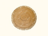 Round jute mat styled in an entryway