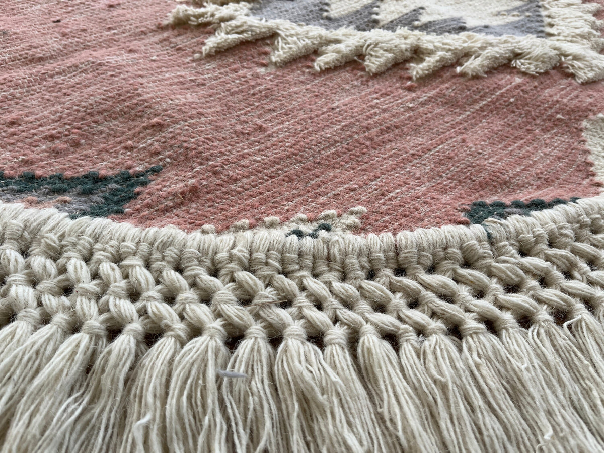 Shaggy pink rug texture close-up showing pile