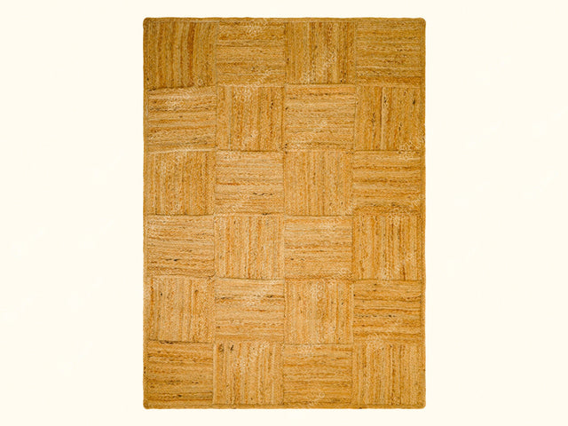 Jute area rug styled in an entryway