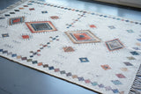Ivory rug placed at an entryway as a doormat
