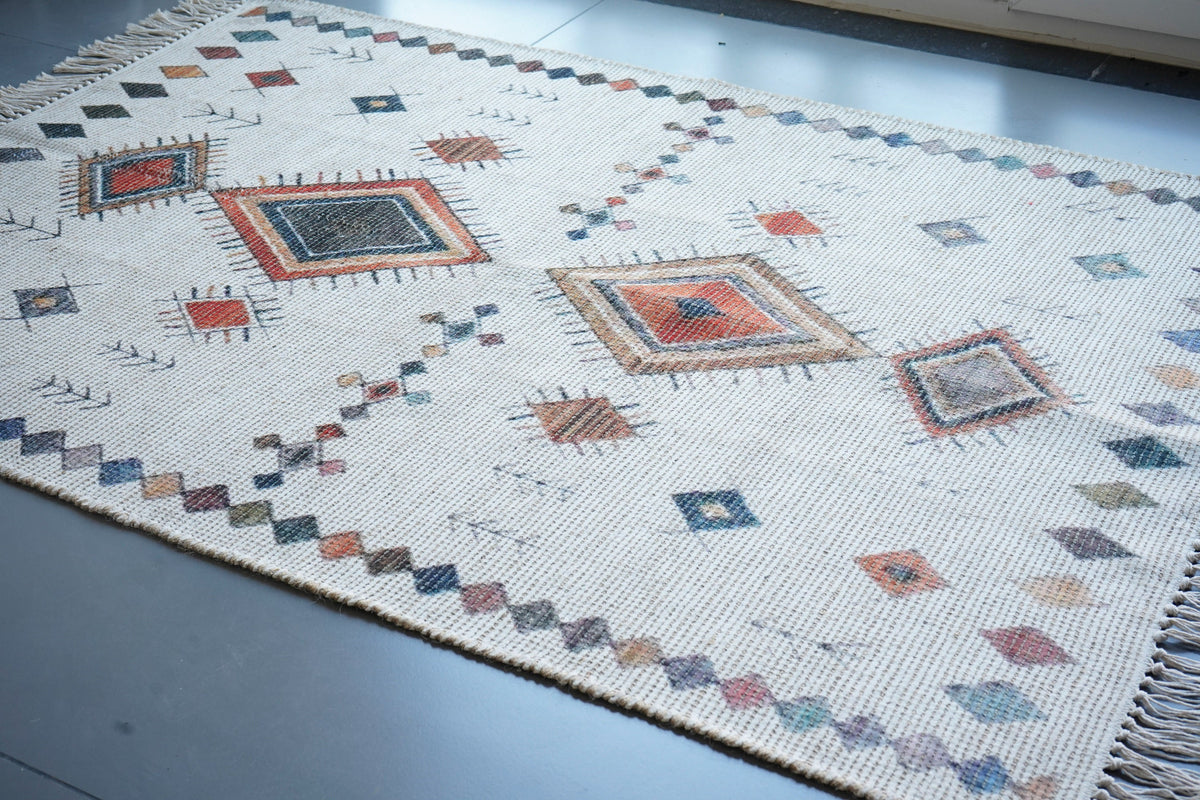 Ivory rug placed at an entryway as a doormat