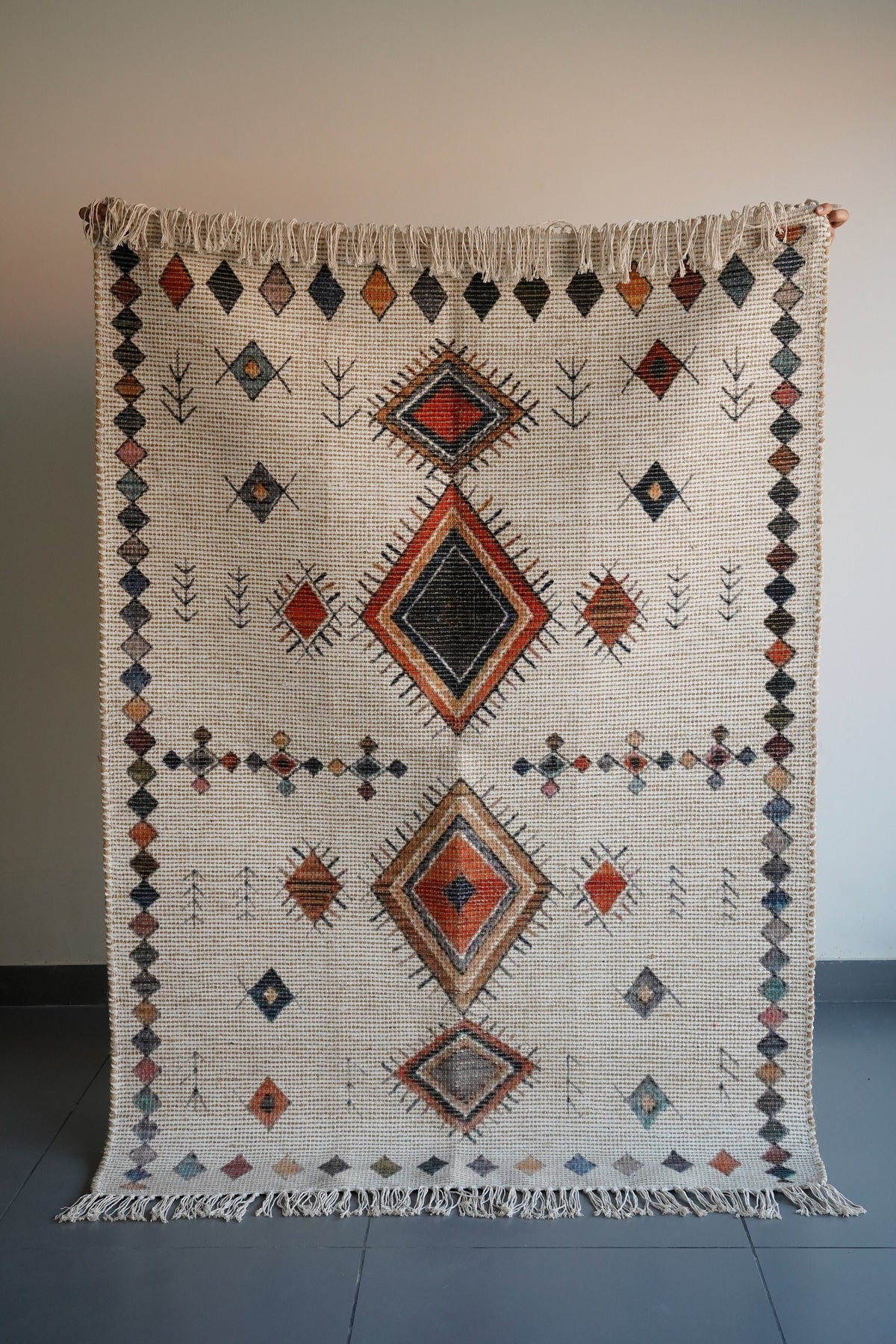 Overhead view of Moroccan print pattern on ivory rug