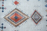 Ivory Moroccan print rug styled with neutral decor