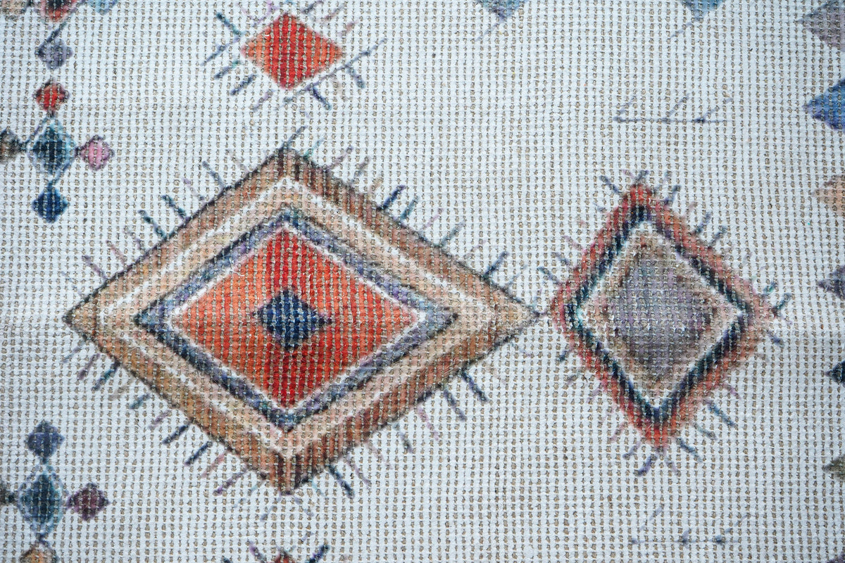 Ivory Moroccan print rug styled with neutral decor