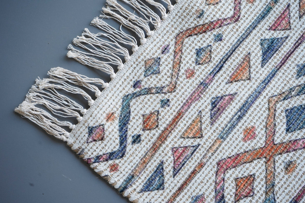 Corner detail of striped Moroccan ivory rug edge