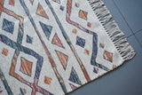 Striped Moroccan ivory rug styled with neutral furniture