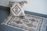 Ivory jute rug shown in small 2x3 entryway size