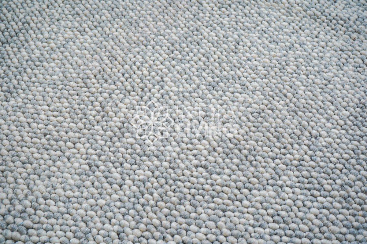 Full flat lay of grey chunky wool rug