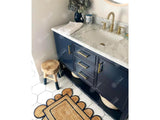 Jute rug corner detail with navy trim