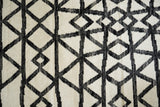Ivory wool rug in bedroom setting