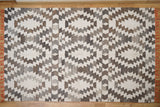 Grey rug under coffee table in living space