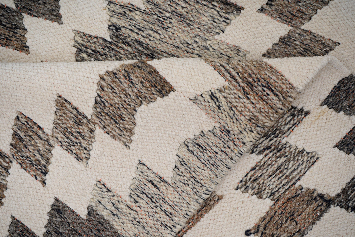 Grey chenille rug styled in living room