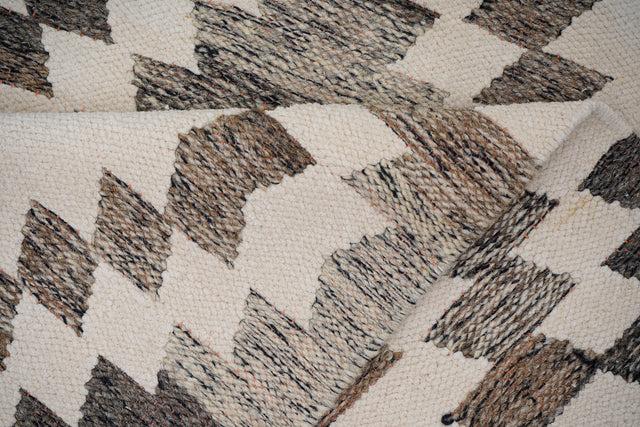 Grey chenille rug styled in living room