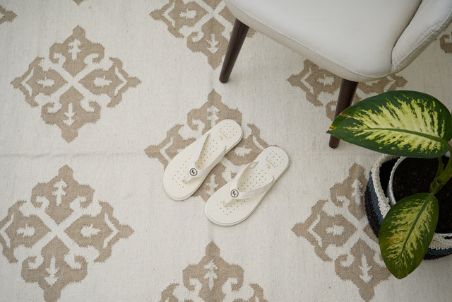 White wool kilim rug styled in a modern living room