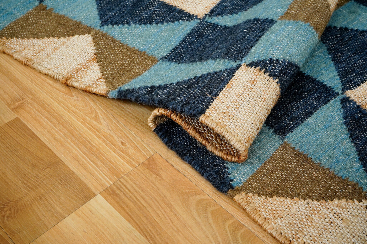 Blue rug placed in a bedroom setting