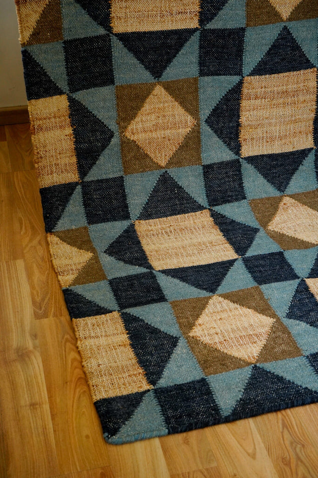 Blue rug styled in a modern minimalist living room