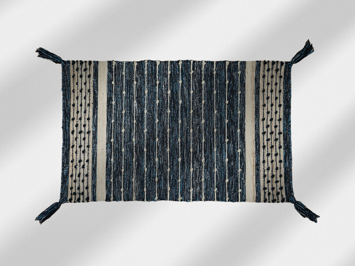 Denim blue kilim rug styled in a living room setting