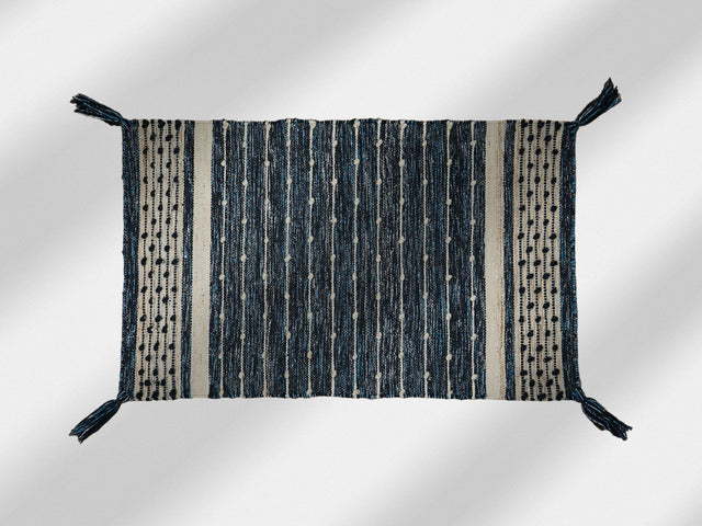 Denim blue kilim rug styled in a living room setting