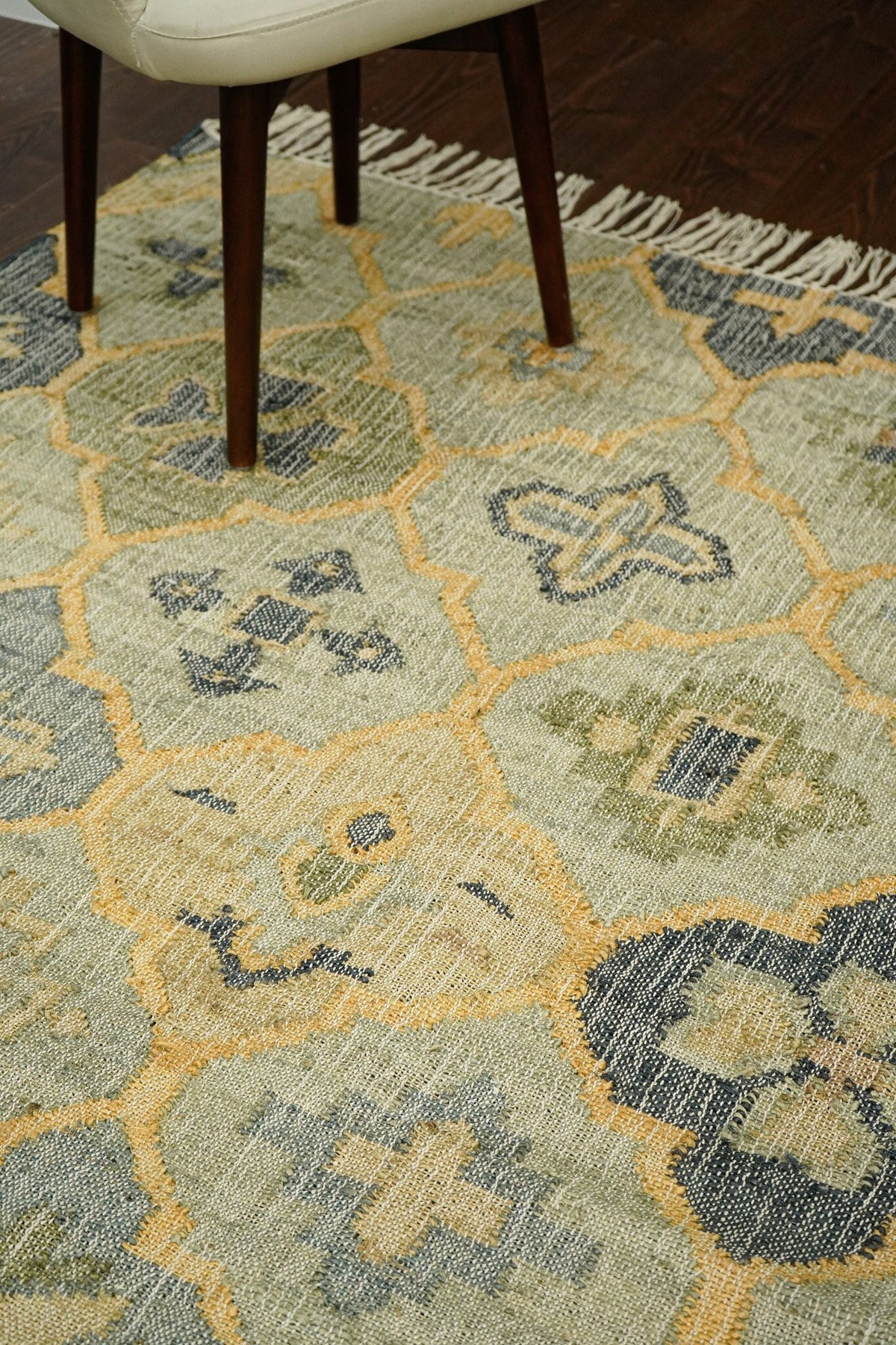 Sage green flatweave jute rug flat view showing abstract pattern