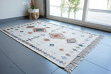 Ivory printed rug shown in living room size