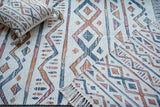 Striped ivory rug placed at an entryway
