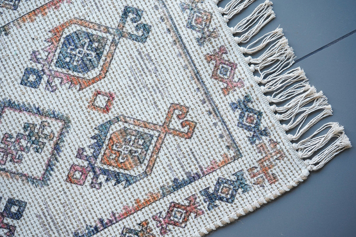 Ivory boho rug corner detail showing edge finishing