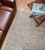Close-up of beige chunky loop wool texture